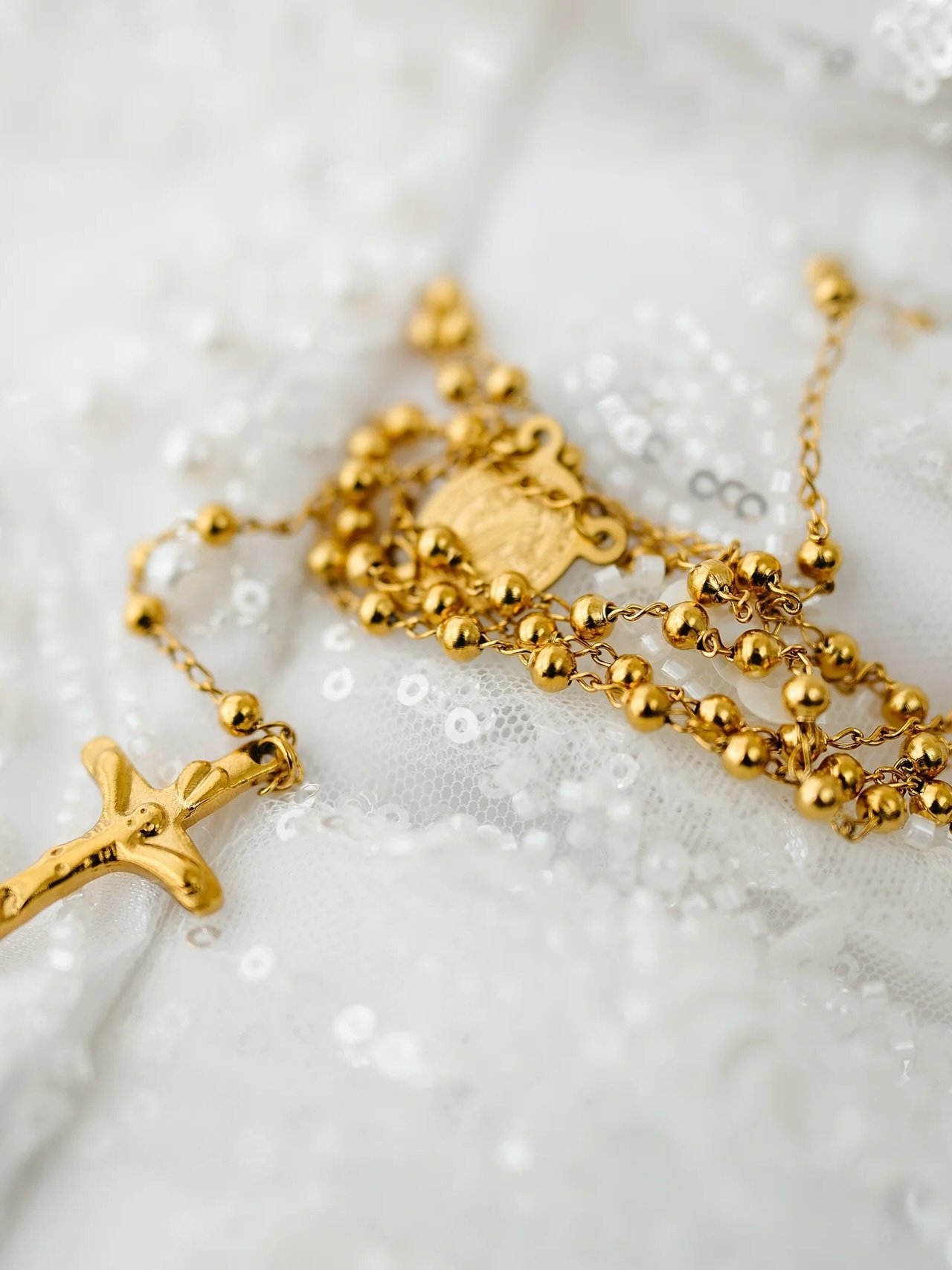 Golden ceremonial details on ivory fabric